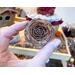 This shows the cedar rosette that decorates Mac's custom hat.